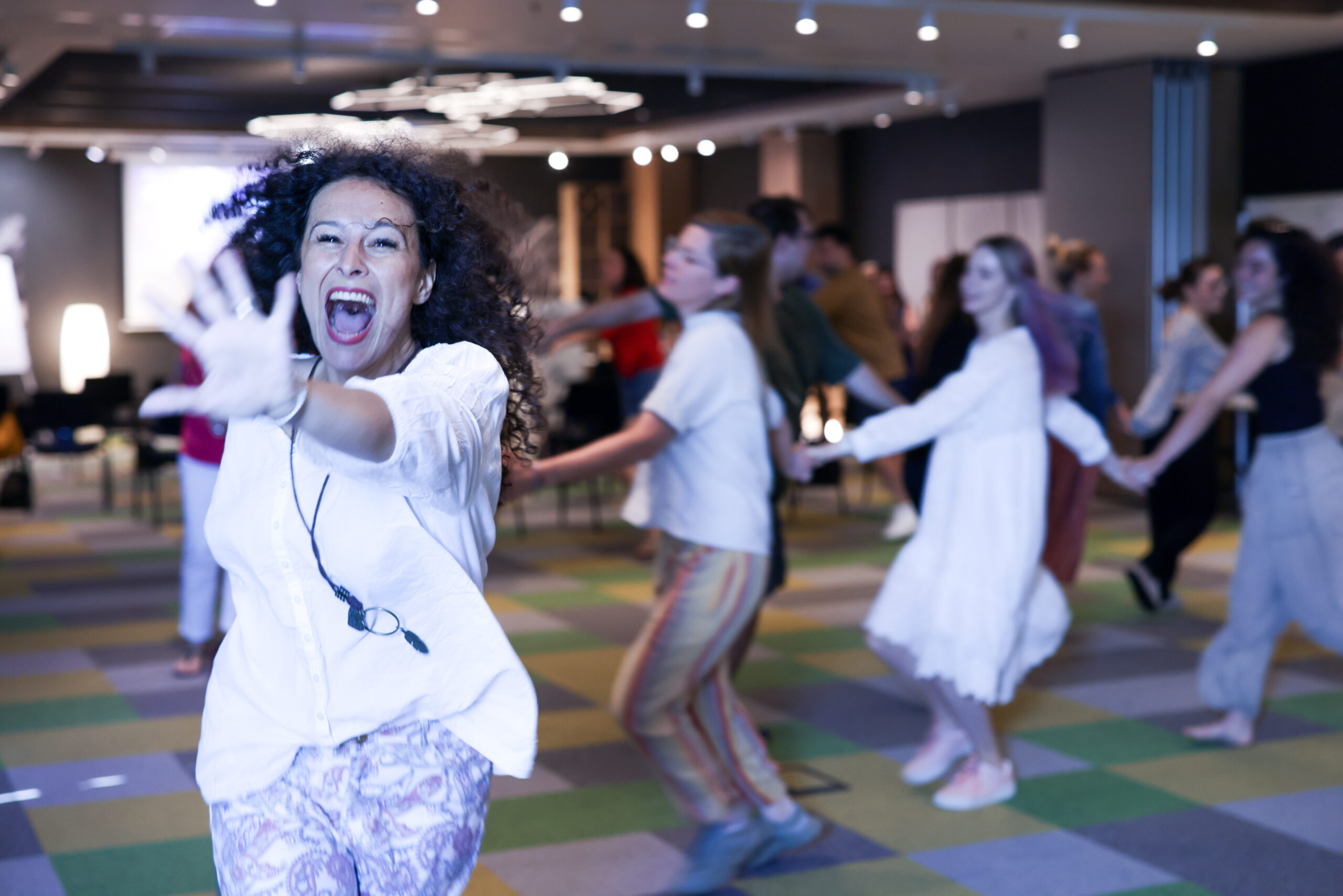 Andrea dancing with workshop participants