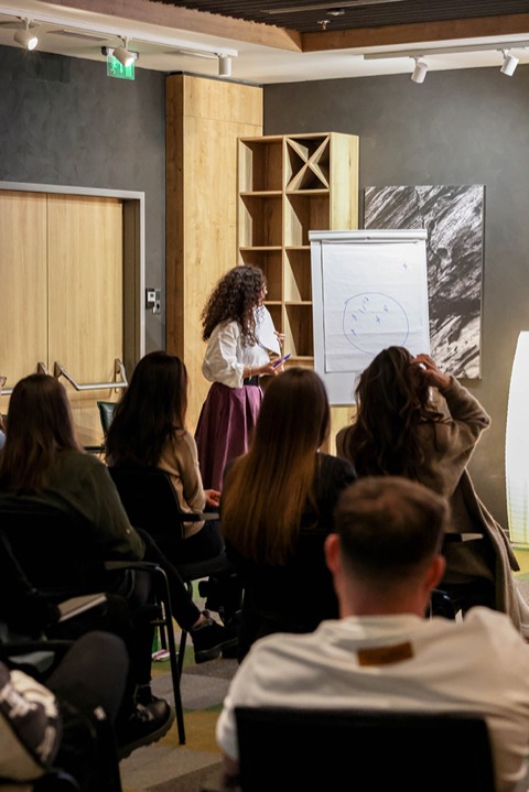 Andrea explaining at the flipchart