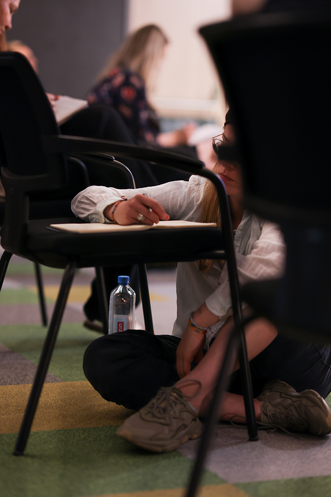A participant taking notes during the workshop